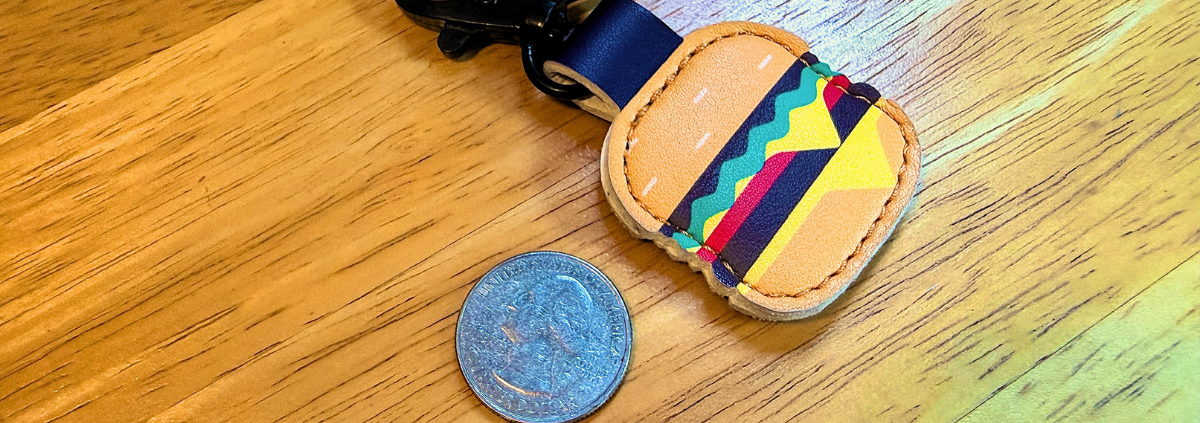 Quarter laying next to an Aldi quarter holder on a keychain | What the Aldi Quarter Teaches About Getting Unstuck